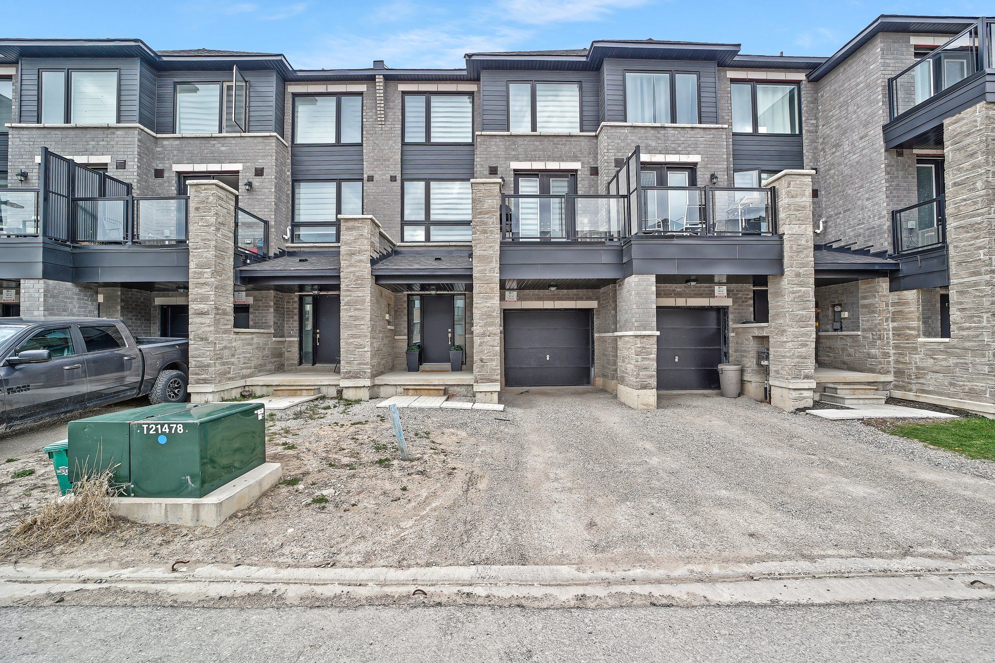 24 Spry Lane Barrie, Ontario Discover contemporary living in this beautifully designed 2-bedroom, 2-bathroom townhouse, ideally located in the highly desirable Innishore neighbourhood. Offering 1,095 square feet of thoughtfully planned living space, this home perfectly balances comfort, convenience, and modern style. Situated just off Yonge Street and Mapleview Drive, this 3-storey residence is close to parks, top-rated schools, scenic hiking trails, and a wide range of dining and shopping options. Commuters will appreciate the proximity to the Barrie South GO Station only 5 minutes away and quick access to Highway 400, just a 10-minute drive. Spend weekends enjoying convenient access to two of Barrie's premier destinations its vibrant waterfront or the upscale Friday Harbour Resort both within 15 minutes from your doorstep. Built in 2023, the home features striking curb appeal with stylish grey brick, black-framed windows, and bold architectural lines. Inside, the open-concept layout is enhanced by sleek laminate flooring and beautiful oak railings. The contemporary kitchen boasts quartz countertops, an extended upper cabinet design, a tiled backsplash, a flush breakfast bar, and stainless steel appliances. It seamlessly connects to the spacious family and dining areas, with a French door leading to a private balcony perfect for outdoor lounging or entertaining.T he main bathroom features quartz countertops and elegant tile finishes, while thoughtful storage solutions throughout the home add to its functional charm. This move-in ready home presents an exceptional opportunity to live in one of Barrie's most vibrant and well-connected communities.