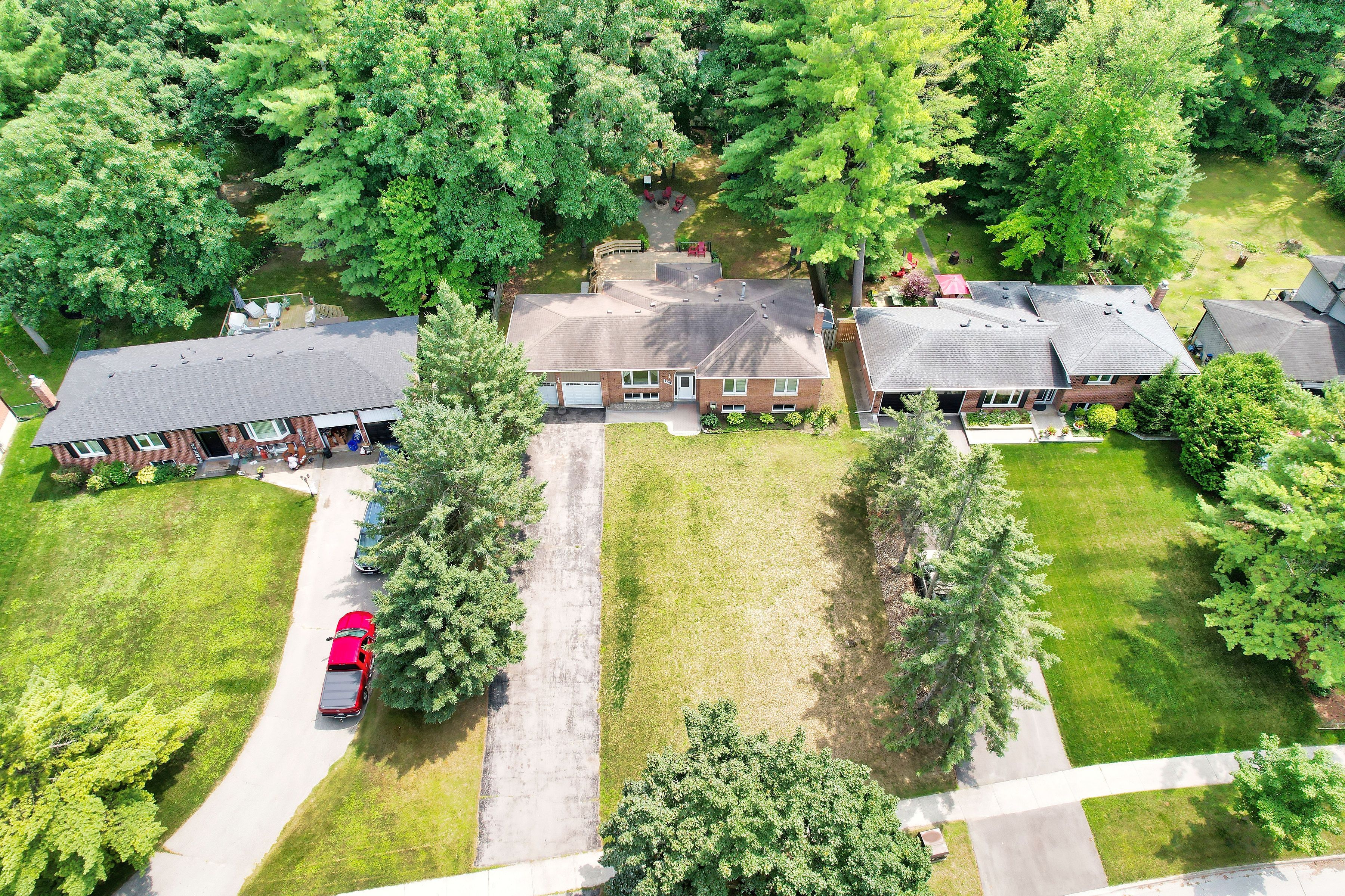 Beautifully Renovated Raised Bungalow on a Picturesque Country-Sized LotDiscover this tastefully updated raised bungalow, nestled on a stunning lot surrounded by mature trees and lush gardens. Designed with family living in mind, this home features an elegant open-concept layout, stylish finishes, and abundant natural light.The gourmet kitchen boasts upgraded cabinetry, sleek quartz countertops, stainless steel appliances, and a functional center islandperfect for cooking and entertaining. Spacious, sunlit bedrooms offer large windows that bring the beauty of the outdoors inside.The bright, fully finished basement offers incredible potential with three additional bedrooms, a separate kitchen, its own laundry, a cozy gas fireplace, and a convenient walk-up to the garageideal for extended family or rental income.Located in a sought-after neighborhood, this home is just minutes from parks, top-rated schools, and shopping. A rare gem offering space, style, and investment potential!