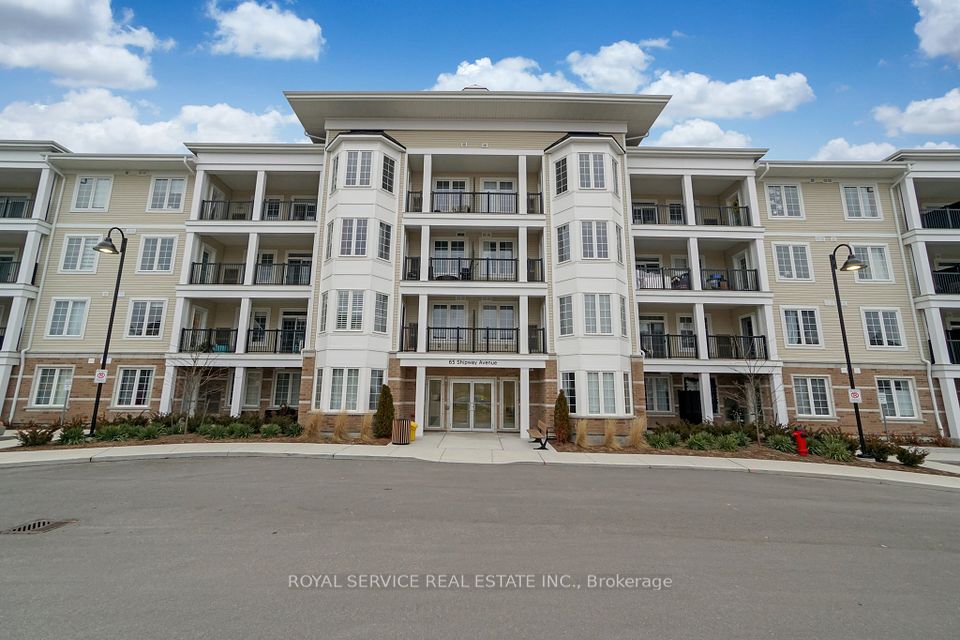 Front View of Condo Building w/ Parking