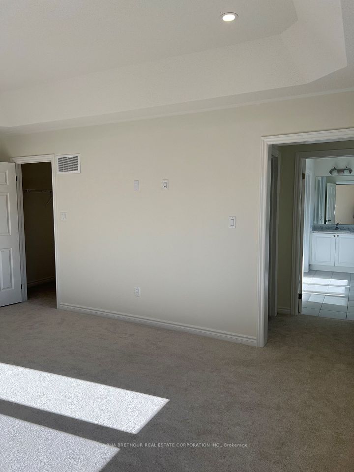 Primary Bedroom with His and Hers Walk-in closets