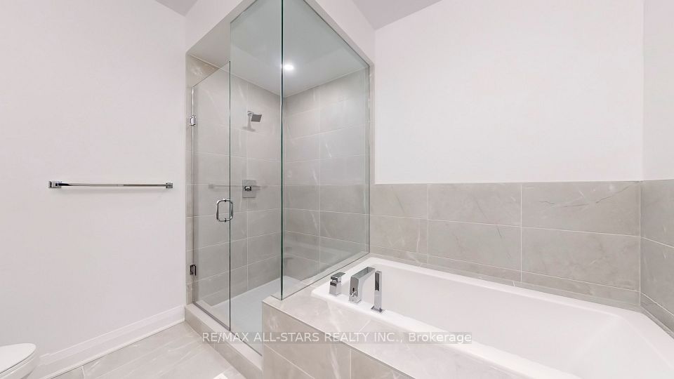 Tall glass shower and deep soaker tub