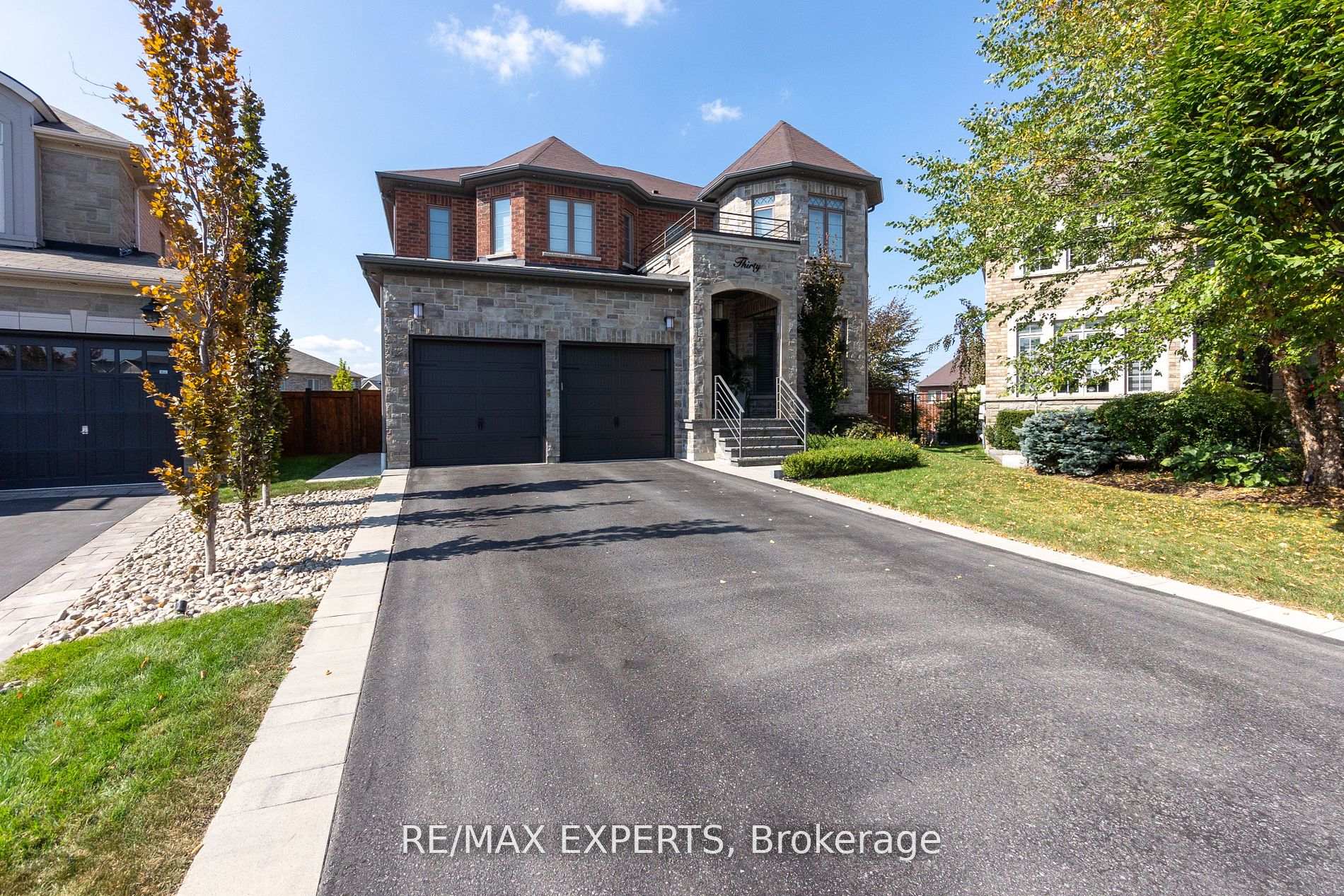 Welcome to the breathtaking 30 Ciro Barillari Court, a true masterpiece nestled at the end of a private cul-de-sac on a sprawling pie-shaped lot. This custom-built home is a sanctuary of luxury, featuring soaring 10' ceilings and an exquisite QTK kitchen outfitted with top-of-the-line integrated appliances and stunning quartz counter tops. Every detail has been meticulously crafted with custom millwork that enhances the elegant design. The family room is a showstopper, boasting massive two-story windows that frame picturesque views of your resort-style backyard. Indulge in the spa-like bathroom for a tranquil retreat or entertain in the fully finished walk-out basement, complete with a kitchen rough-in, an additional bedroom, and a bathroom-ideal for guests or family. Step outside to your outdoor haven, featuring a covered loggia and a fully equipped outdoor kitchen-perfect for hosting gatherings or enjoying a quiet evening with a glass of wine. With countless upgrades throughout, this home is truly a dream come true. Don't miss your chance to experience this exceptional property !!