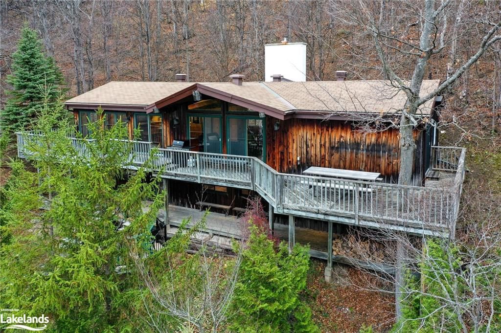 Back of property featuring a wooden deck