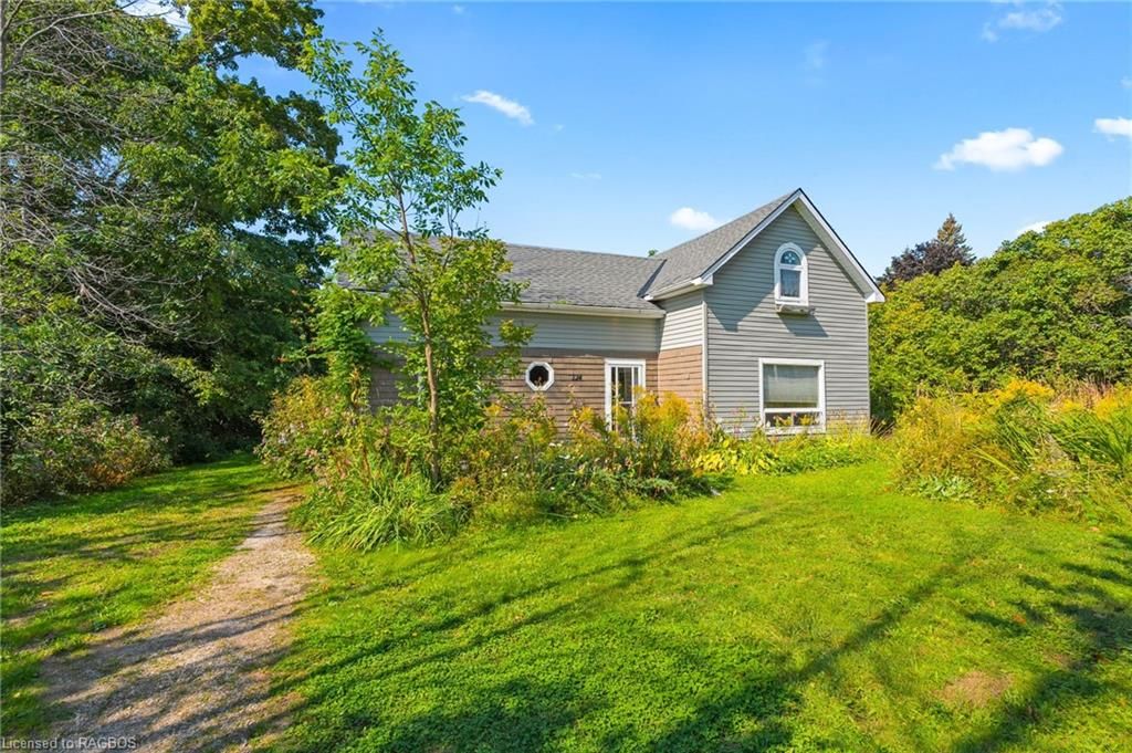 View of property exterior with a yard